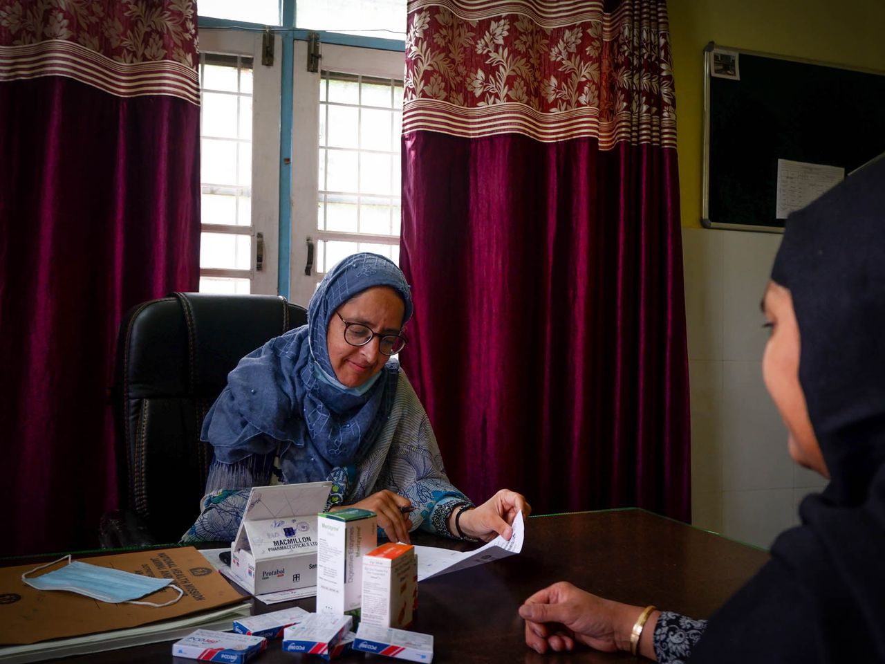 Dr. Riffat, who has been treating tribal women for decades, is seen treating a patient at a hospital on the outskirts of Srinagar. Date: 28 April, 2022.