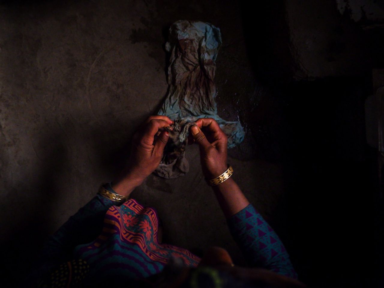 Naseema, 35, washes an old blue scarf that she uses instead of sanitary pads during her periods at her home. Naseema says she can’t afford sanitary protection and that her priority is to feed her children. “We have built a house, but only one room is liveable. My husband is a labourer. How can I afford a sanitary pad that costs, what, 50 Indian rupees? I don’t know, I’ve never bought one,” Naseema says, pointing at the earthen floor and glassless windows of her house. Date: 19 April,2022.