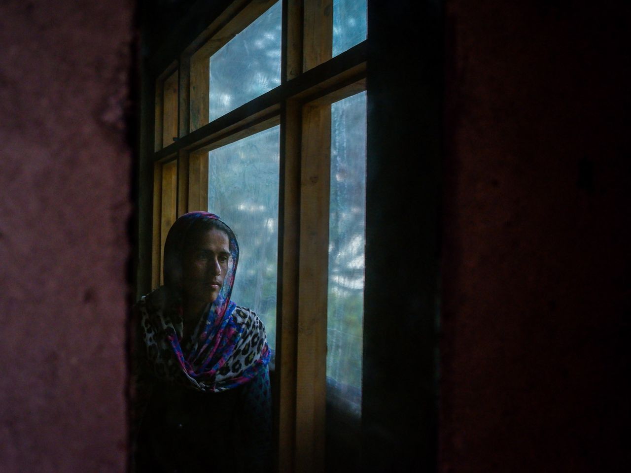 One of the myths Naseema believes in is that she will develop an infection on her face if she looks into a mirror while menstruating. Naseema stands in her kitchen as her frame is captured in the mirror. Date: 24 April, 2022.