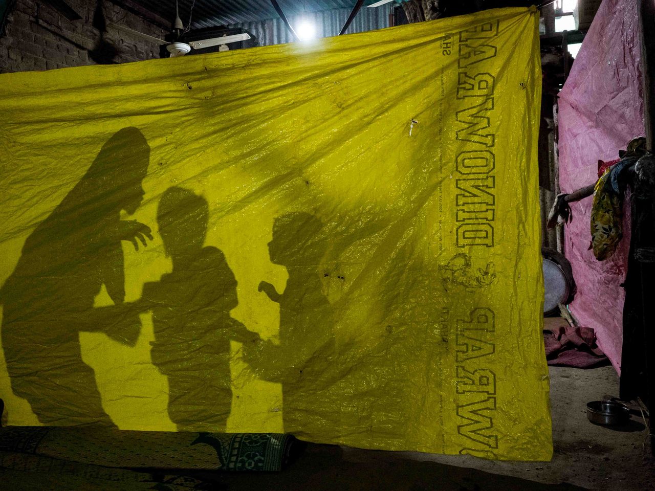 A displaced Muslim family use a plastic sheet as wall partition inside what once was a stable after their home was demolished by the authorities following communal violence in a drive that they claim was against encroachment in Khas-Khas wadi, Khargone in India's Madhya Pradesh state on April 15, 2022. As a national campaign by right-wing groups inflames local tensions, Muslim communities are facing the harshest punishments, according to activists, analysts and retired officials.